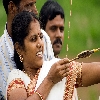 Lady aiming at a target with bow and an arrow