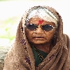 Old woman looking curiously
