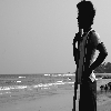 A boy watching the sea at Rishikonda beach Visakhapatnam, Andhra pradesh