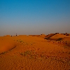 Red color of sand dunes during sunset time