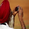 Old man taking photo using P & S camera