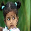 Blue dressed girl child portrait from Canon 85/1.8 lens on 20D