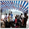 people dancing on deck of launch travelling in river Godavari to Bhadrachalam