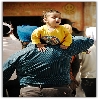kid feeling uncomfortable on father shoulder near Gurdwara of Manikaran