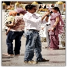 kid looking seriously on a person taking a snap at Manikaran