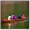 A family enjoying the boat ride in Bhimtal lake.