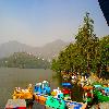 view of the boats parked on the bank of the lake