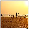 Playing cricket at Juhu beach Mumbai 