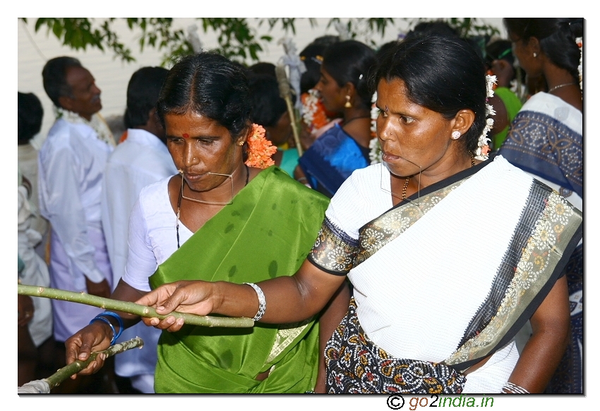 Women with locking at the mouth giving their offerings
