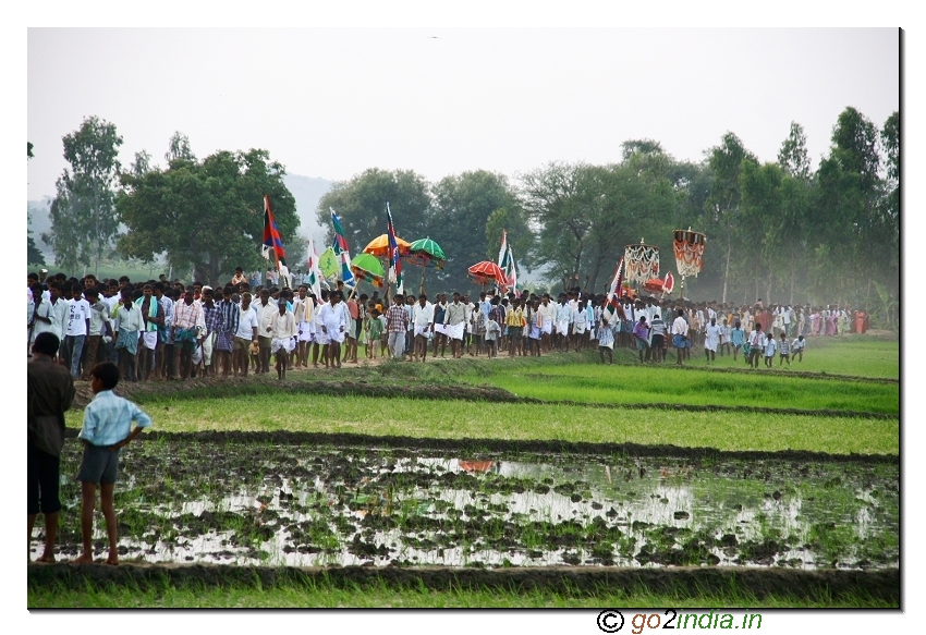 Village people gathering during the procession