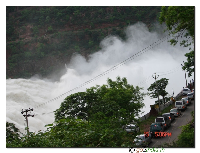 Visitors watching the water flow from dam