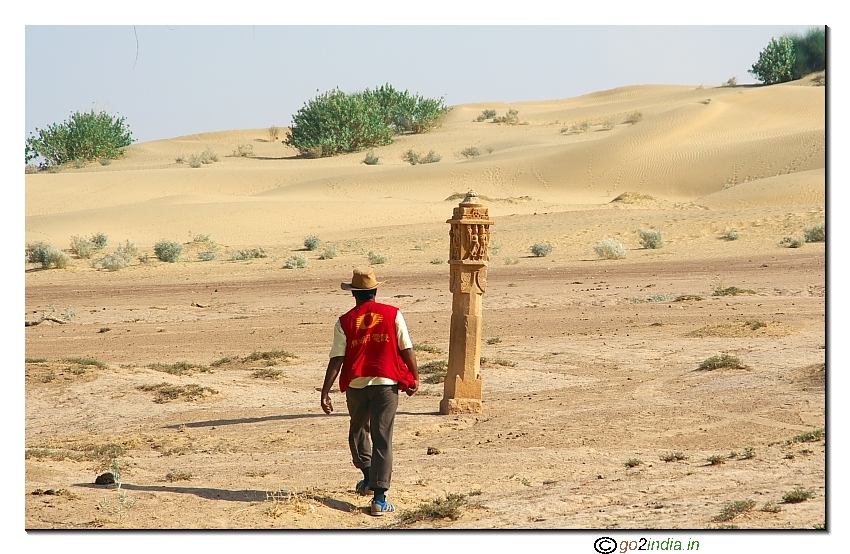 person walking alone in the desert