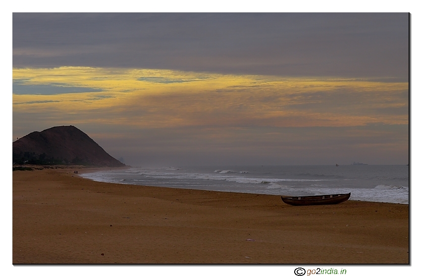 Lonely boat at Yarada beach during evening