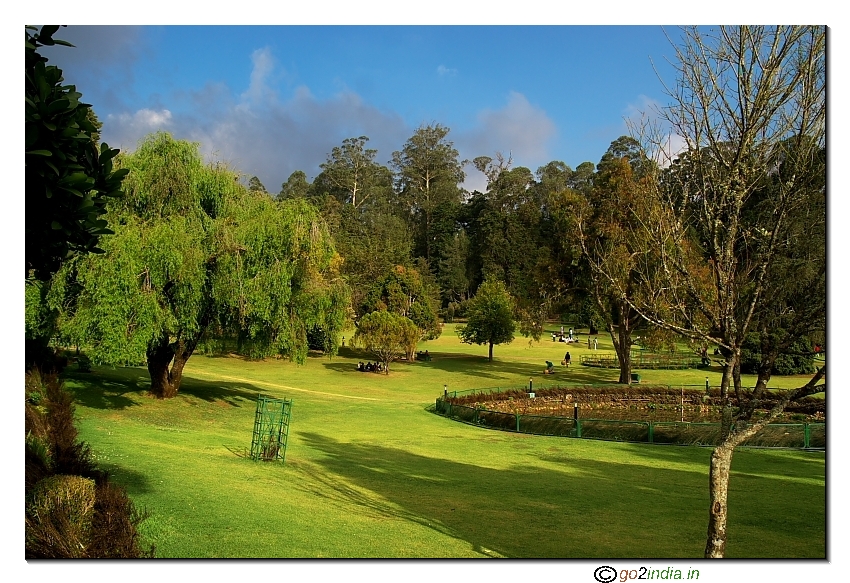 wide angle view of Botanical garden with green grass and blue sky