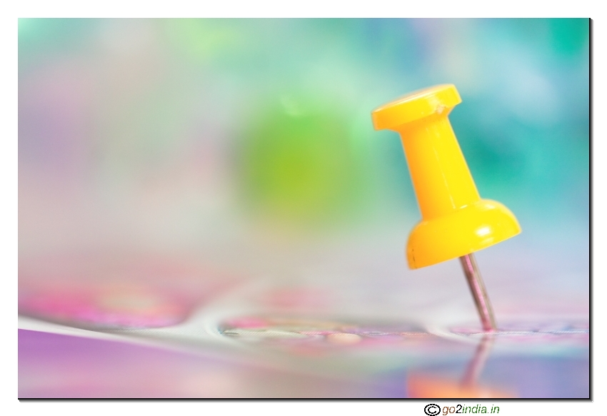 Macro of a pin with back ground blurr abstract material