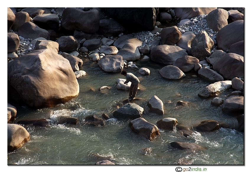 Man inside water at Rudraprayag confluence of two rivers Mandakini & Alaknanda