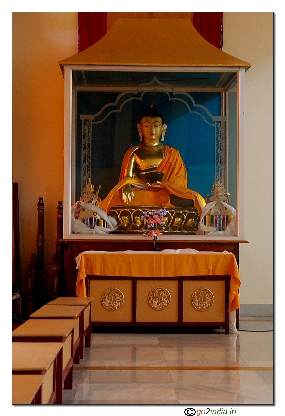 Prayer benches in front of Statue inside Monastery  at Manali