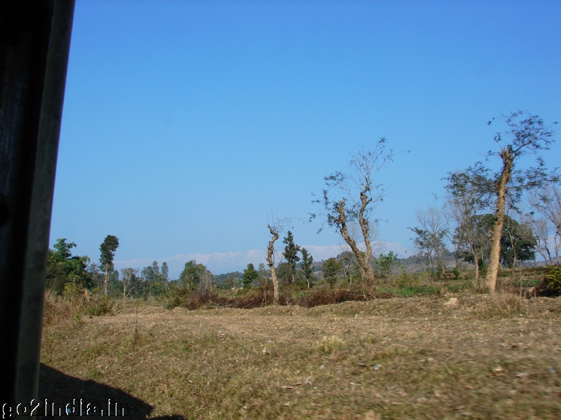 Snow capped Dhauladhar hills at the front of the train