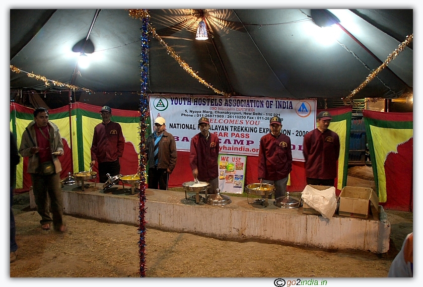 Volunteers serving food at Sarpass base camp Kasol