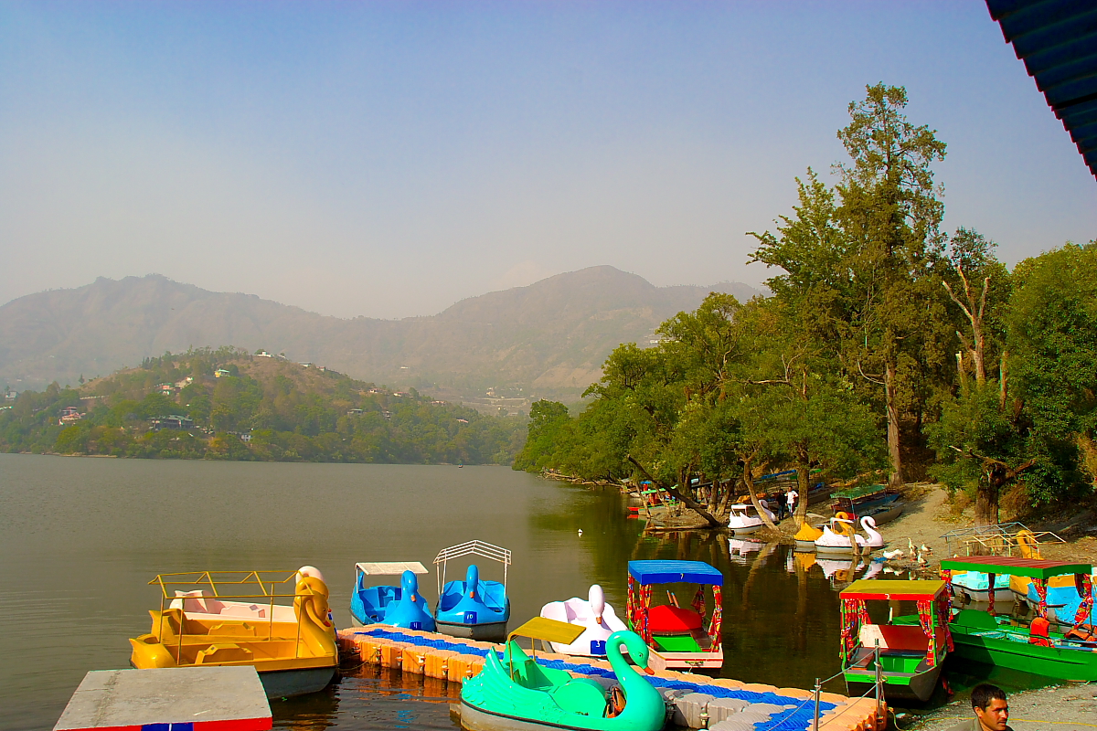 view of the boats parked on the bank of the lake