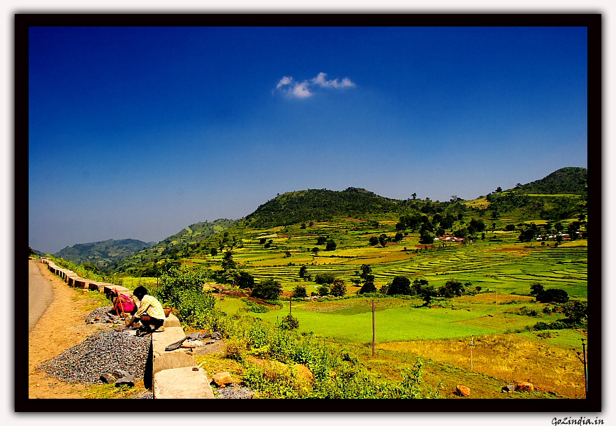 local people breaking pebbles for there daily earnings