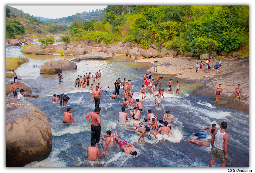 Taking bath at flowing stream at Chaparai