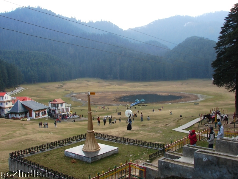 Saucer shaped ground surrounded by thick deodar trees